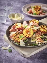 Burnt peaches with Comté, prosciutto and hazelnuts 